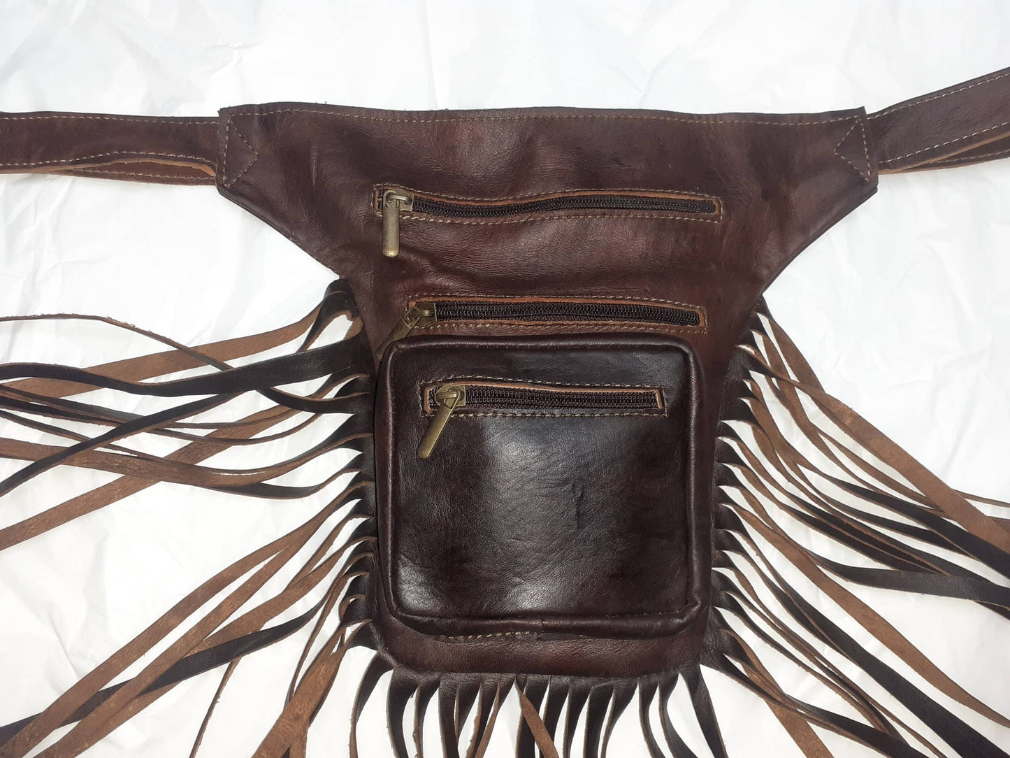 Riñonera de flecos plana